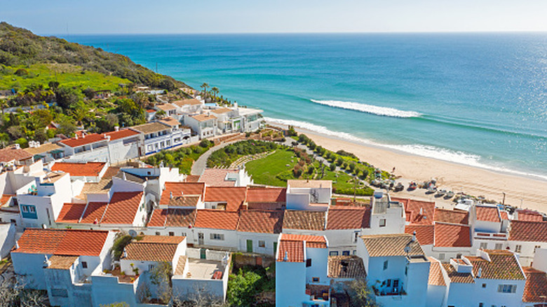 Dwellings overlooking the ocean in Salema, Portugal