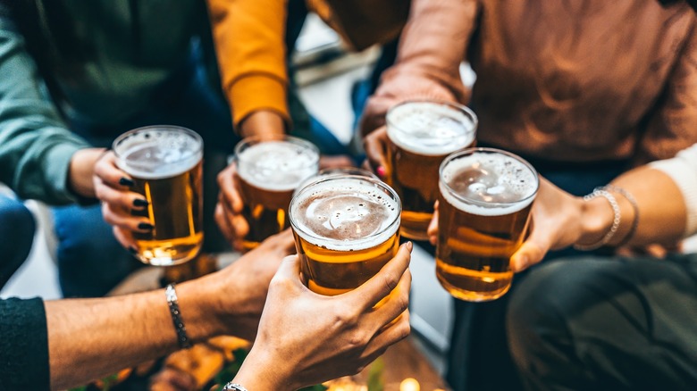 Friends drinking beer and toasting