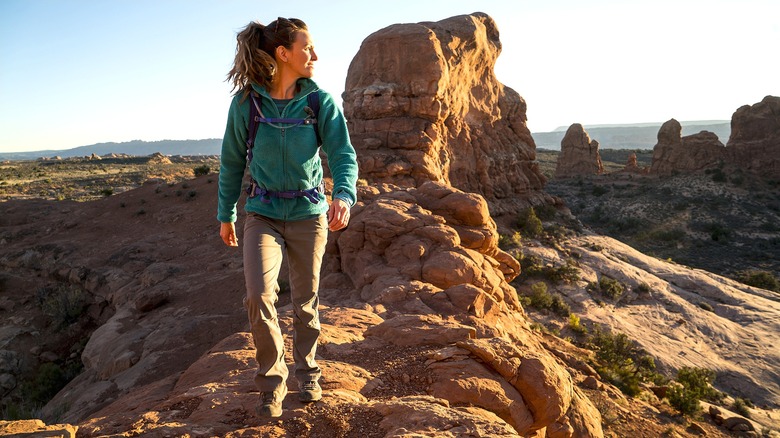 Woman hiking in Arches National Park