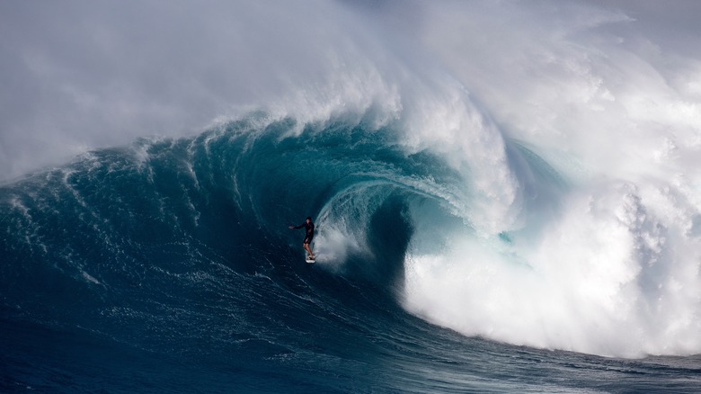 Surfer exiting barrel wave