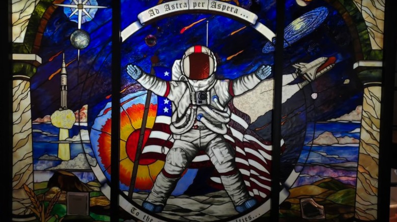 Stained glass window at the Cosmosphere, showing an astronaut and spacecraft