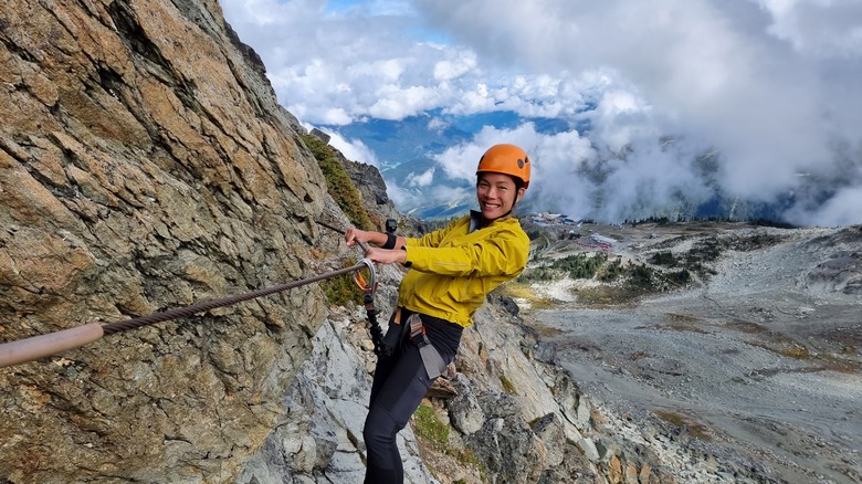 A woman completing Via Ferrata, Canada