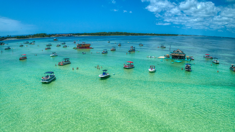 Boats anchored on a sandbar