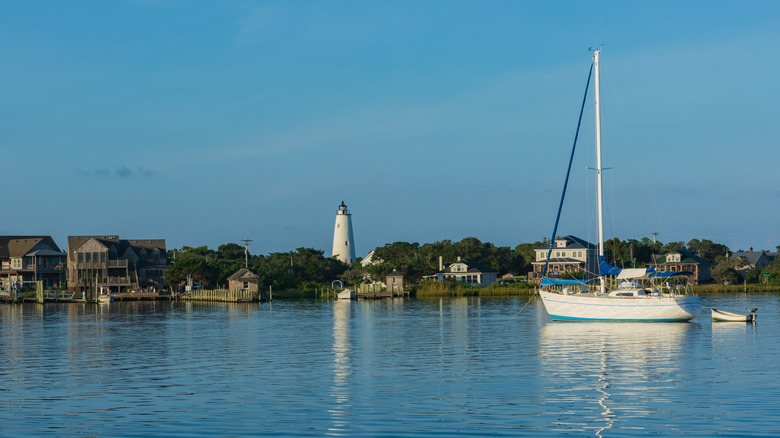 Sailboat anchored near the Ocracoke lighthouse in Silver Lake harbor