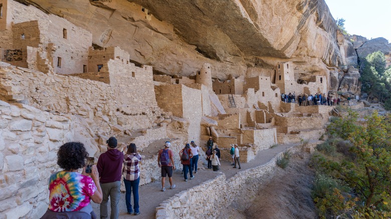 People exploring Cliff Palace