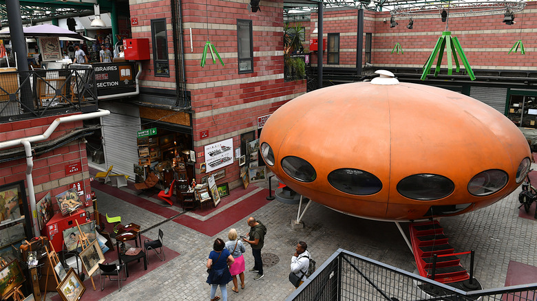 A flying saucer film prop in the middle of Dauphine Market.