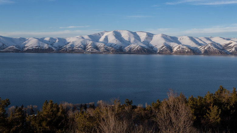 snow capped mountains around Lake Sevan, Armenia, in clear weather at sunset