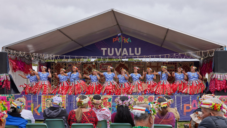 Tuvalu dancers on a stage in traditional costumes