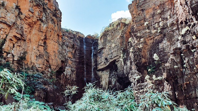 trickling waterfall on red cliffs