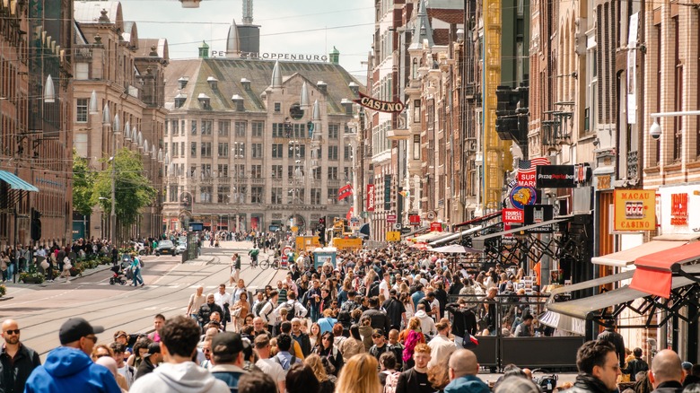 People walking on a busy street in Amsterdam in the Netherlands