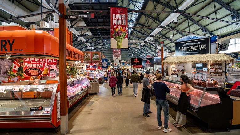 People walking through St. Lawrence Market in Toronto