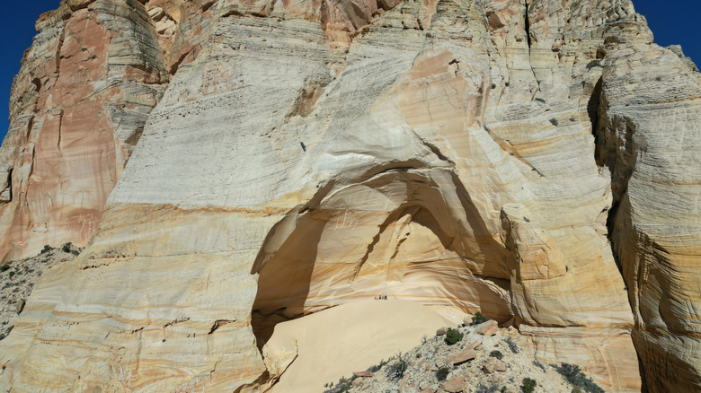 People standing in the middle of the Great Chamber at Cutler Point, Utah