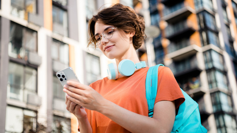 Person using their mobile phone on vacation