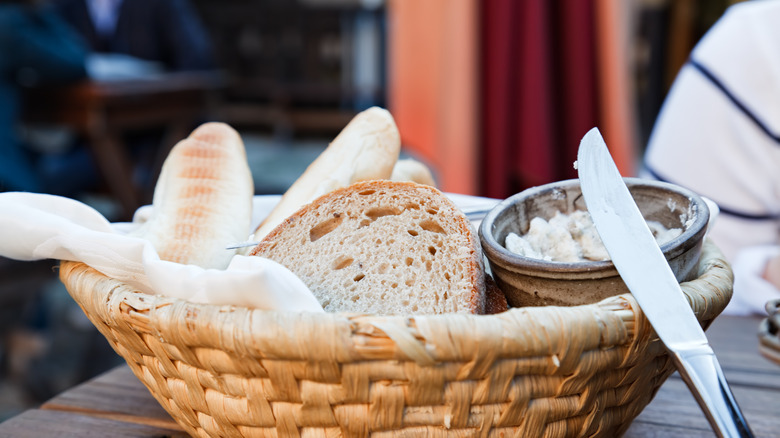 Basket of free bread and spread on table