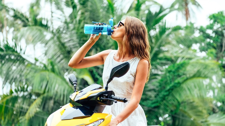 Drinking from reusable water bottle