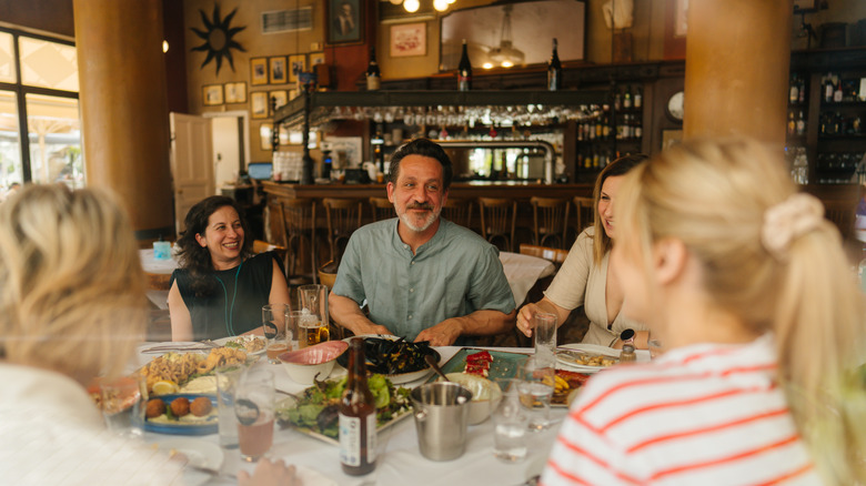 Friends eating appetizers at restaurant