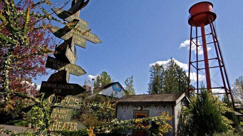 Directional sign, historic buildings, and water tower at McMenamins Edgefield in Troutdale