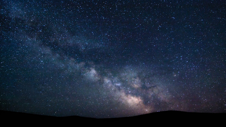 Milky Way at night over hills