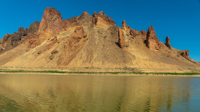 Rock formations rise above the Owyhee Reservoir in Oregon