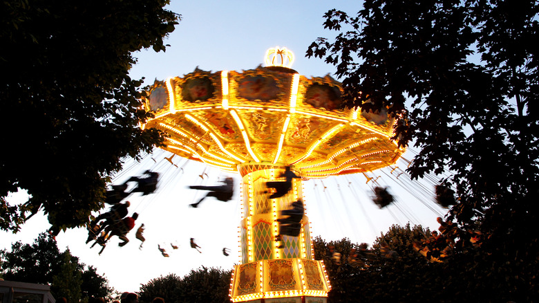 flying swing attraction at night