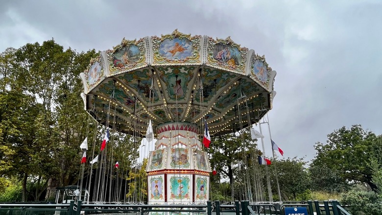 flying swing attraction with trees