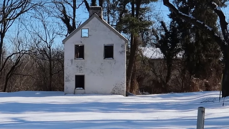 One of the abandoned buildings in Fricks Lock Village on a snowy day