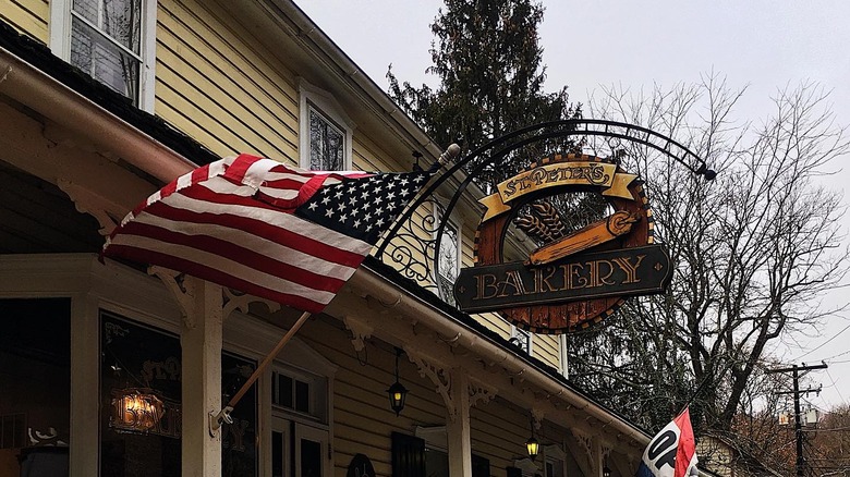 St. Peter's Bakery storefront with an American flag in St. Peter's Village in Pennsylvania