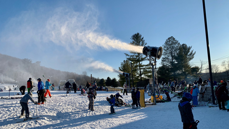 Skiers and snow gun at Liberty Mountain Resort in Pennsylvania