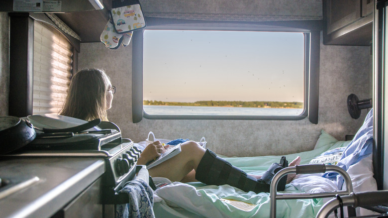 girl with cast inside RV