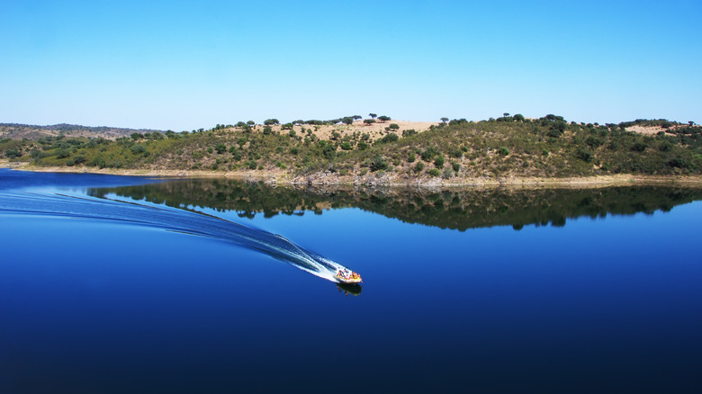 Boat gliding through lake waters