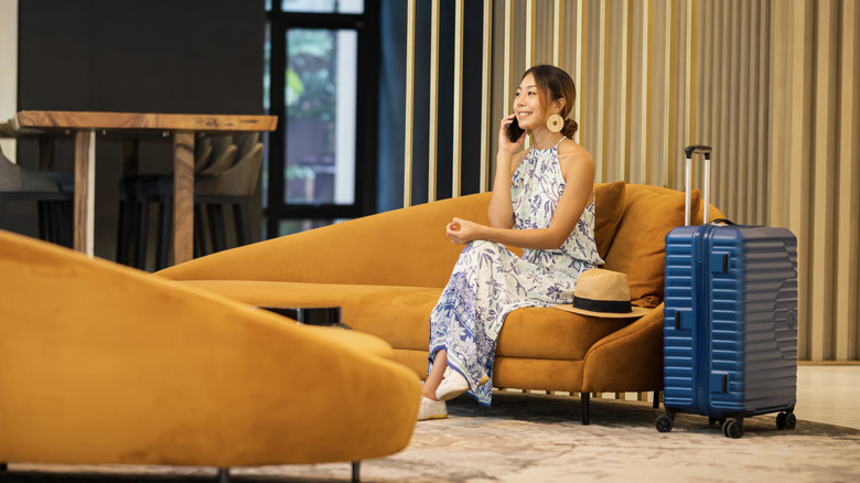 A woman sitting in an airport lounge