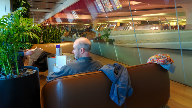 A man sitting in Virgin Atlantic's Clubhouse loung in Heathrow airport