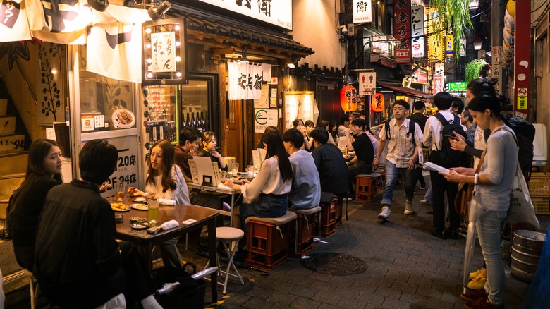 Tourists and locals eating in a restaurant in Tokyo