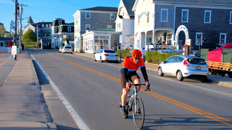 A bike rider near the shops and hotels in New Shoreham's Old Harbor District.