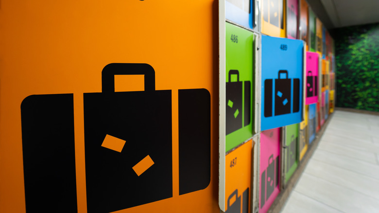 Colorful lockers with suitcase symbols at train station