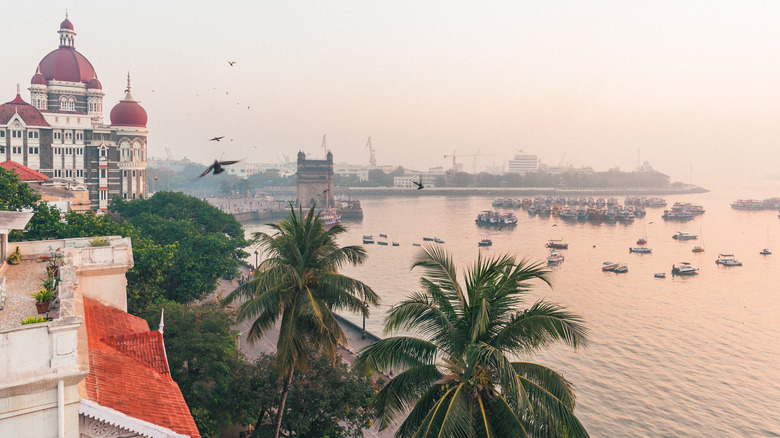 A busy city waterfront at dusk