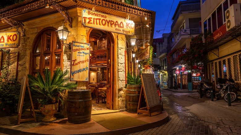 Psyri neighborhood restaurant lit up at night