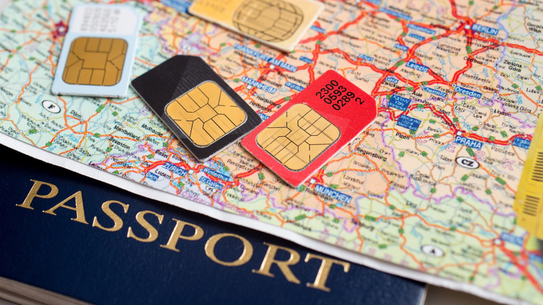 passport and SIM cards on European map