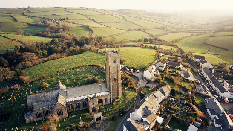 Aerial shot of a castle and fields in Devon, England