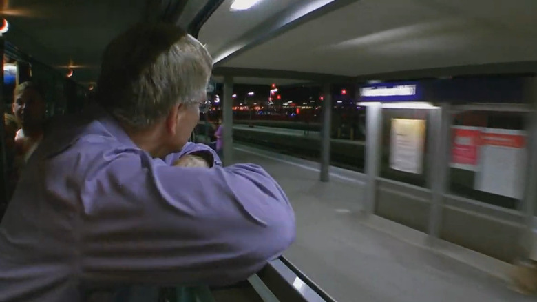 Rick Steves looking train window night