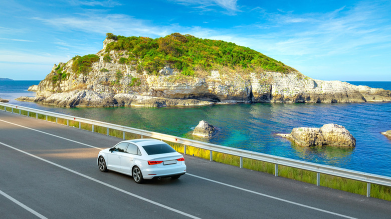 A car on a coastal road in Spain