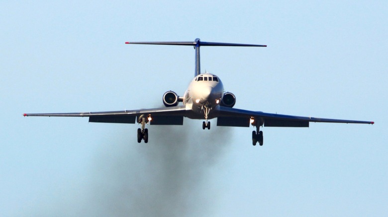 Plane emitting fumes during takeoff