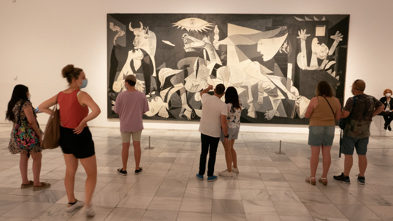Visitors looking at a Picasso painting