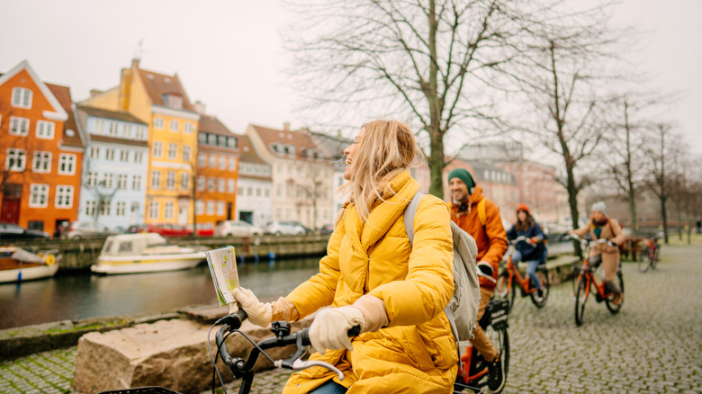 Tourists cycling through Amsterdam