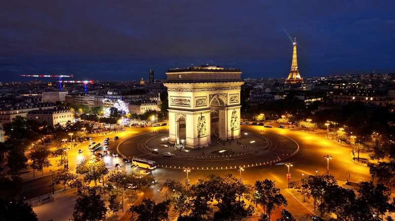 Night view of the Arc de Triomphe and the Eiffel Tower in Paris