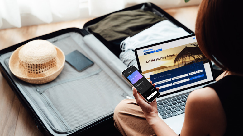 A woman booking a hotel on her computer