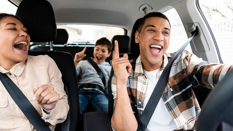 Family singing in the car on a road trip