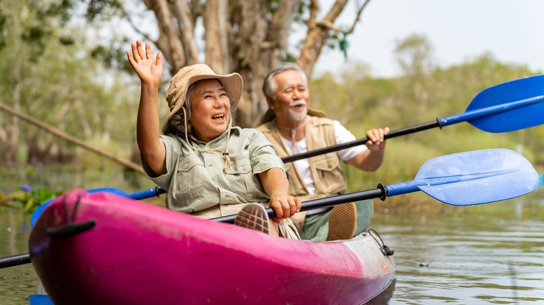 Couple kayaking on a river