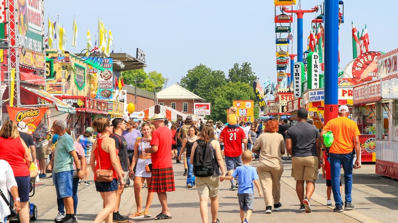 People enjoying a local fair