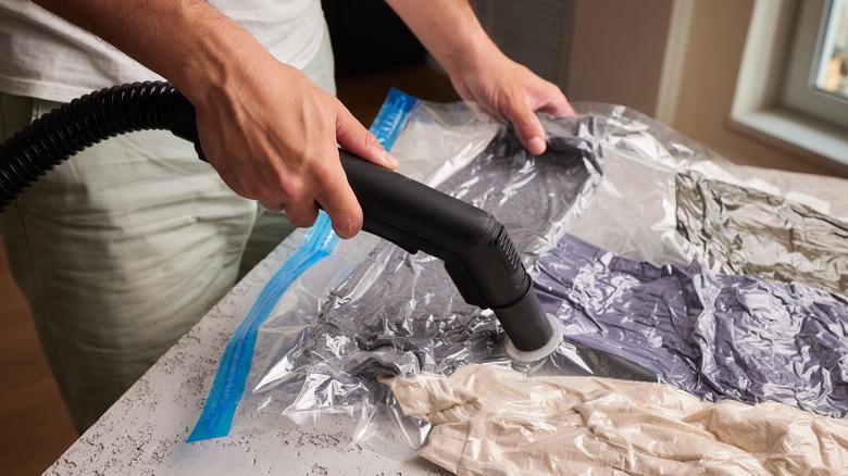 Person using vacuum seal bags